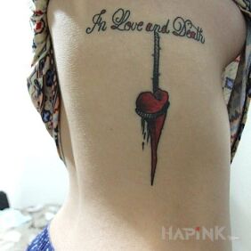 Tattoo Love&death on the ribs motif: lettering