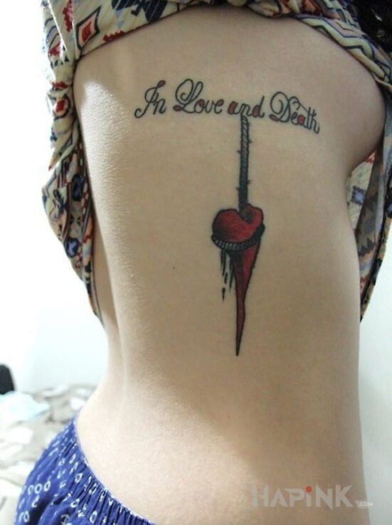 Tattoo Love&death in lettering motif on the ribs