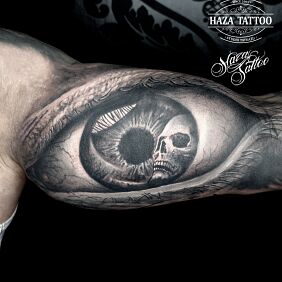 Tattoo Eye tattoo On the arm motif: skulls style: realistic