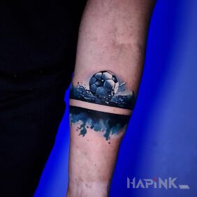 Tattoo Watercolor bracelet with a soccer ball on the forearm style: realistic