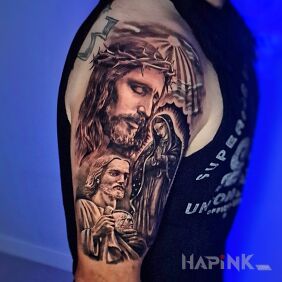 Tattoo Religious motif on the arm on the upper arm motif: religious style: realistic