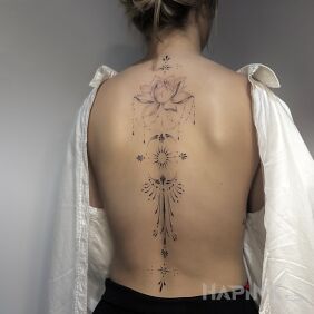 Tattoo Subtle, feminine tattoo on the back motif: mandalas style: minimalistic