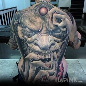 Tattoo The face of a demon on the back motif: demons