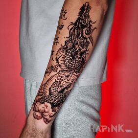 Tattoo Chinese dragon on the forearm on the forearm motif: fantasy style: graphic / illustrative