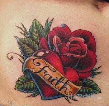 Tattoo Wiara in lettering motif on the stomach