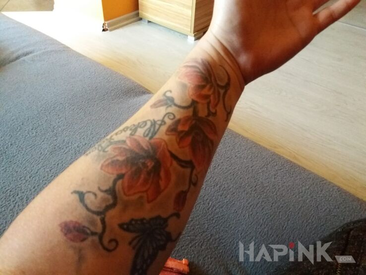 Tattoo Kwiatki in butterflies motif on the forearm