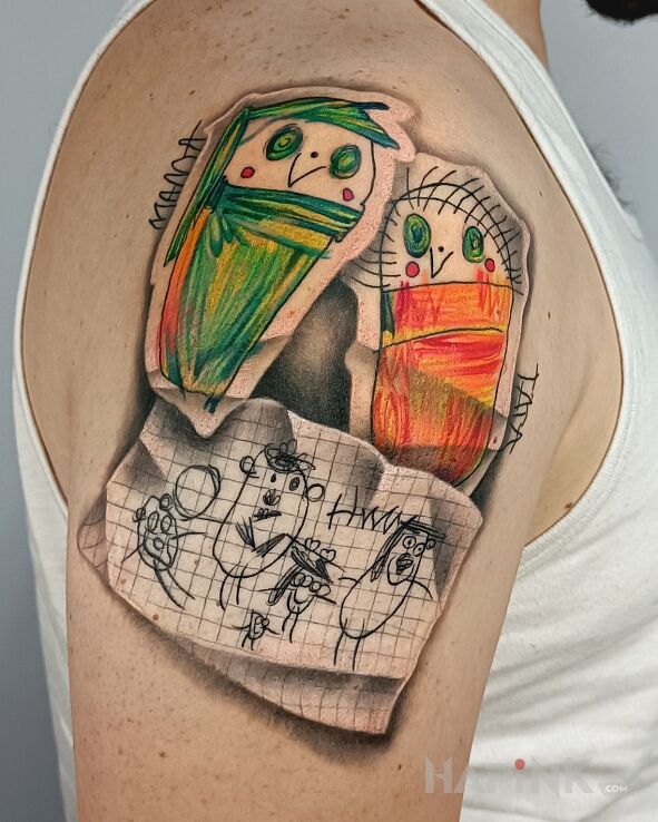 Tattoo Świat dziecka cz2 in colorful motif and realistic style on the upper arm