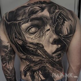 Tattoo Back. Face. Woman. on the back motif: black and gray style: realistic