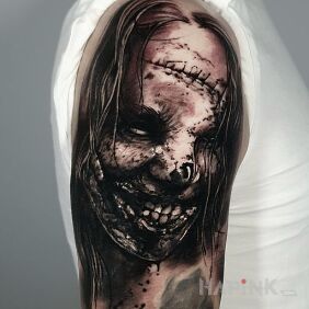 Tattoo Horror. Woman. Face. on the upper arm motif: faces style: realistic
