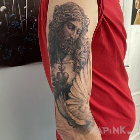 Tattoo Christ; part of the sleeve On the arm motif: faces style: realistic