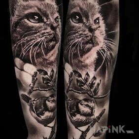 Tattoo Animals. Cat. Tit. On the arm motif: floral style: realistic