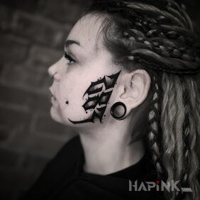 Tattoo Numbers on the face. on the face motif: dark style: calligraphy