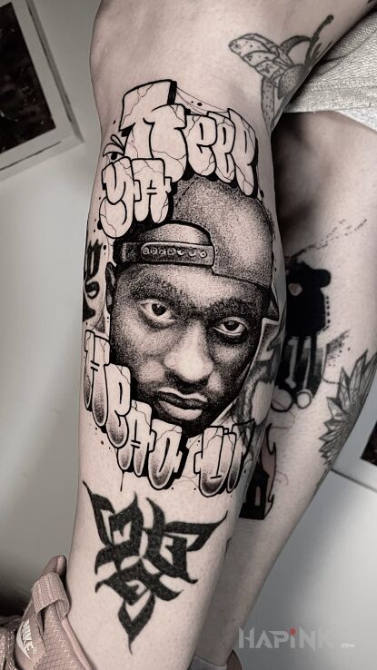 Tattoo 2pac + lettering. in faces motif and graffiti style on the calf