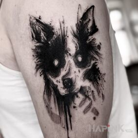 Tattoo Puppy. on the upper arm motif: dark style: graphic / illustrative