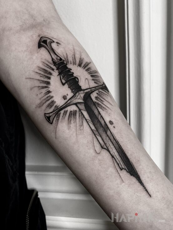 Tattoo Miecz. in fantasy motif and graphic / illustrative style on the forearm