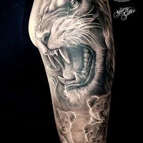 Tattoo Lion family on the upper arm motif: animals style: realistic