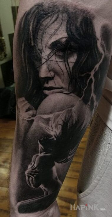 Tattoo Ponetna niewiasta in faces motif and realistic style on the forearm