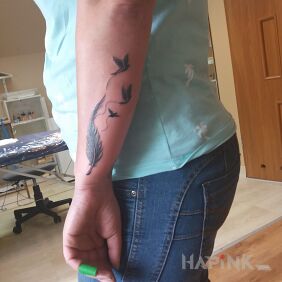Tattoo Snowflake on the forearm motif: animals