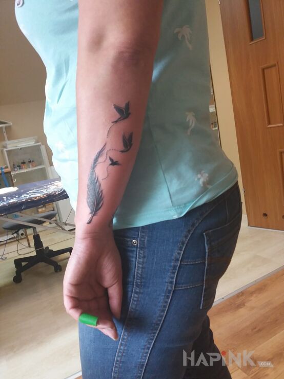 Tattoo Śnieżynka in animals motif on the forearm