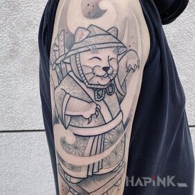 Tattoo Maneki-neko Cat on the upper arm motif: characters style: graphic / illustrative