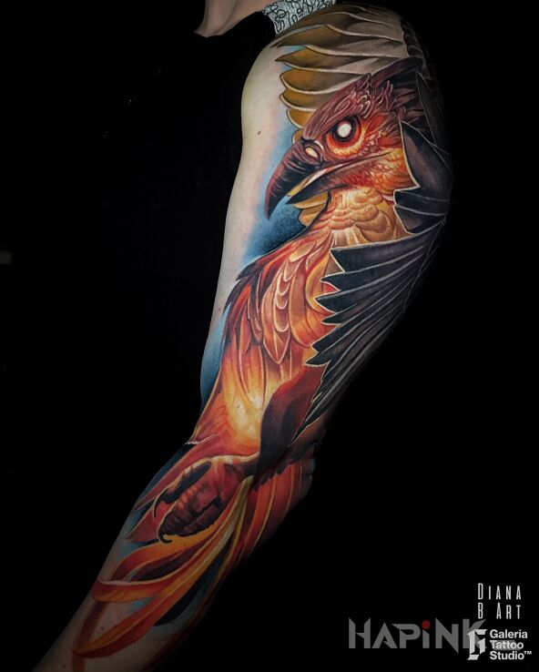 Tattoo Feniks tattoo in colorful motif and realistic style On the arm