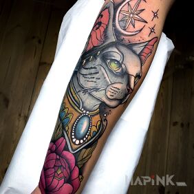 Tattoo 🌟 A stunning tattoo featuring a cat with mystical symbols. �🌸 on the forearm motif: animals style: neo-traditional