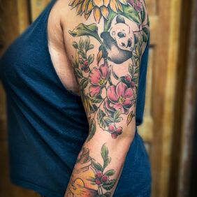 Tattoo Plant and animal collage on the upper arm motif: colorful style: graphic / illustrative