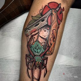 Tattoo Combining mechanical and natural elements on the leg motif: colorful style: neo-traditional
