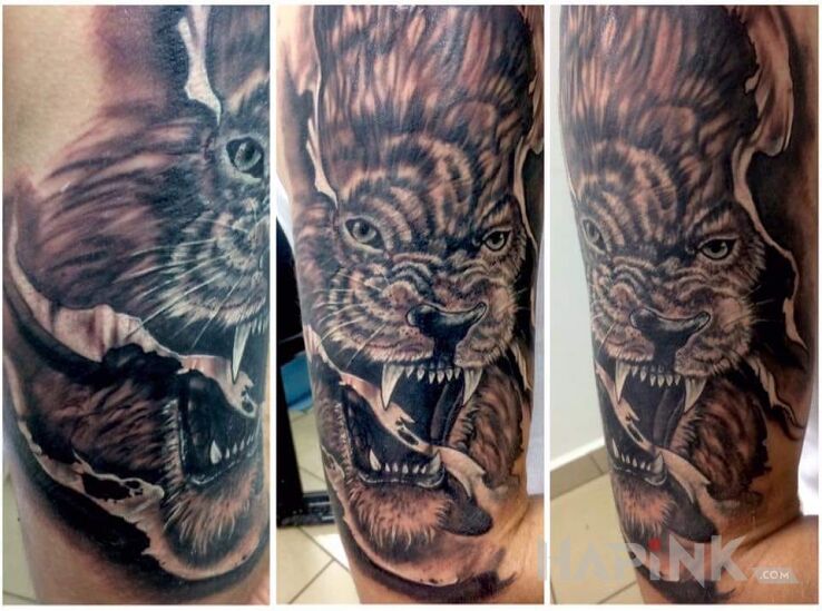 Tattoo Znak zodiaku Lew ♌ in animals motif on the upper arm