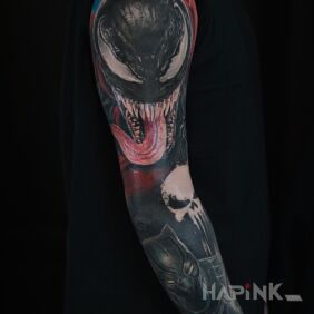 Tattoo Venom Marvel On the arm motif: dark style: realistic