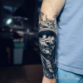 Tattoo Samurai on the forearm motif: black and gray style: realistic