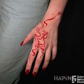 Tattoo Red abstraction on the hand on the hand motif: other style: abstract