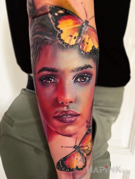 Tattoo Portret in faces motif and realistic style on the forearm