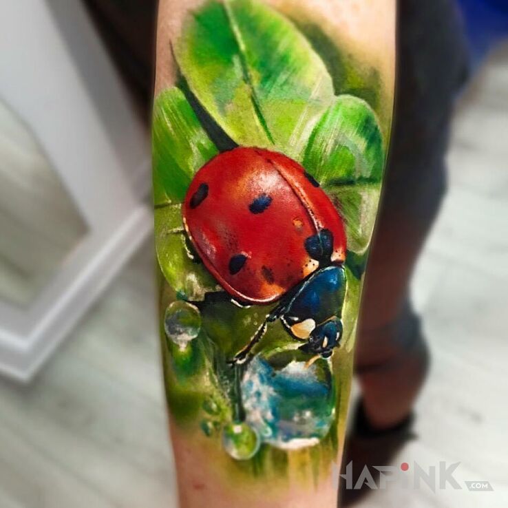 Tattoo Biedronka- jak dobrze, że jest tak blisko. in colorful motif and realistic style On the arm