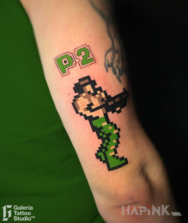 Tattoo Tatuaż pikselowy Contra v2 in pixelated motif and graphic / illustrative style On the arm