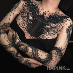 Tattoo Angel of death on the upper arm motif: black and gray style: blackwork / blackout