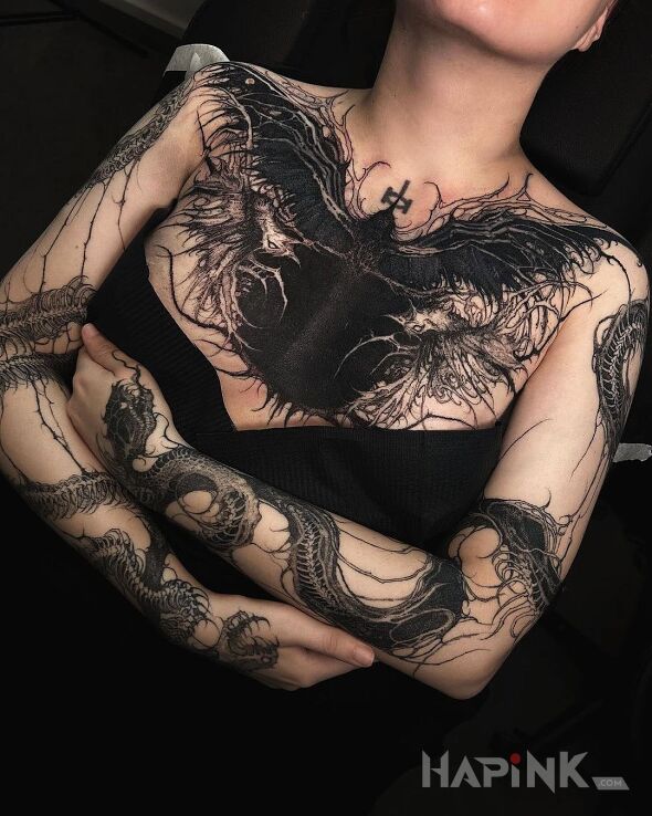 Tattoo Angel of death in black and gray motif and graphic / illustrative style On the arm
