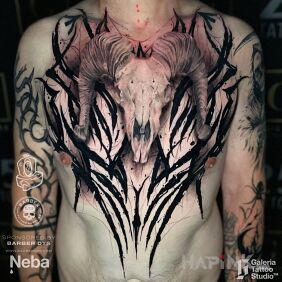 Tattoo Black ornaments on the upper arm motif: ornaments style: blackwork / blackout