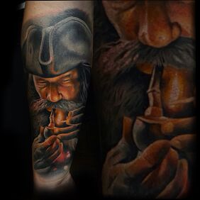 Tattoo Ahoy pirates on the forearm motif: colorful style: realistic