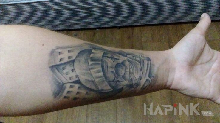 Tattoo Klaun in characters motif and chicano style on the forearm