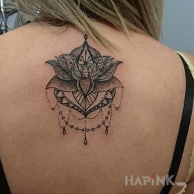 Tattoo Lotus flower on the back motif: flowers