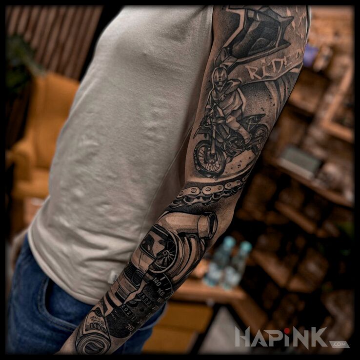 Tattoo Miłość do jazdy na motorze in sleeves motif and realistic style on the forearm