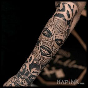 Tattoo Balaclava On the arm motif: black and gray style: realistic