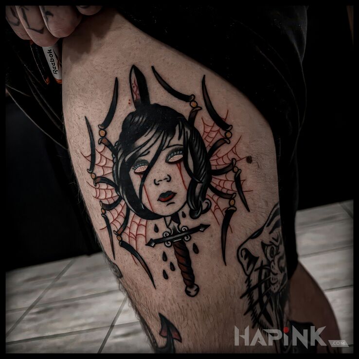 Tattoo Arachne in faces motif and oldschool style on the leg