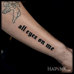 Tattoo Tupac Verse on the forearm motif: criminal lettering style: calligraphy
