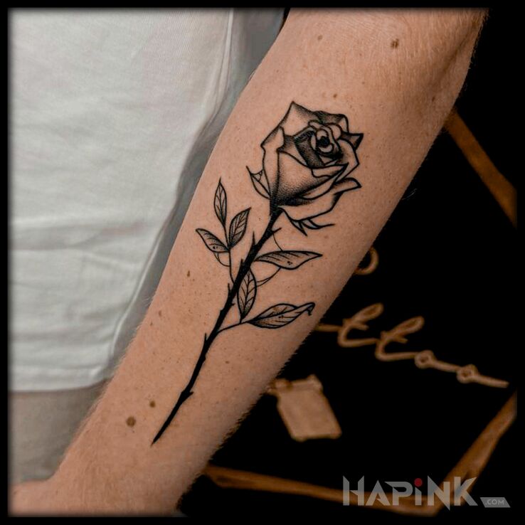 Tattoo Różyczka in flowers motif and oldschool style On the arm