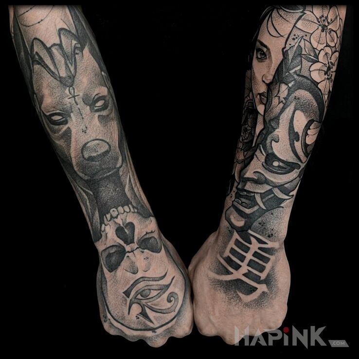 Tattoo Egipt vs Japonia in black and gray motif and graphic / illustrative style On the arm