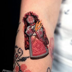 Tattoo SLAVIC PUPPET DOLL On the arm motif: colorful style: graphic / illustrative