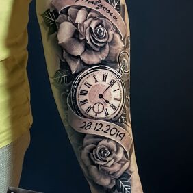 Tattoo Clock hidden in roses On the arm motif: floral style: realistic