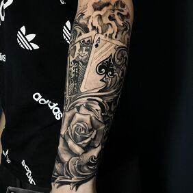 Tattoo ROSE CARDS on the forearm motif: casino style: realistic